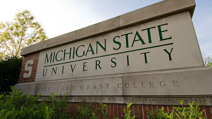 A sign with the words Michigan State University.