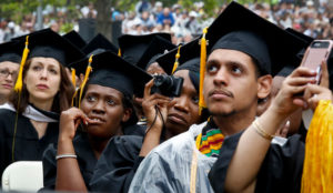 Graduating students listen to a commencement speech on June 3, 2016, in New York.