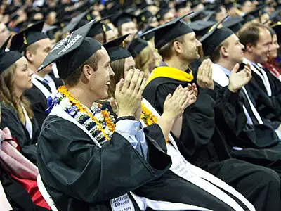 Students during a graduation ceremony at Utah State University.
