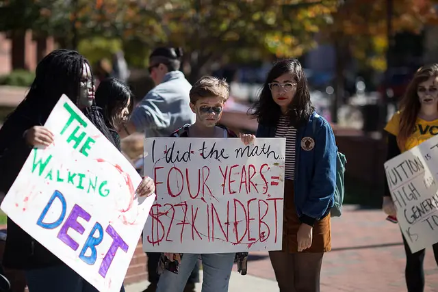 "The Walking Debt." Students take to the streets to protest the debts they're forced to take on to obtain a college degree.