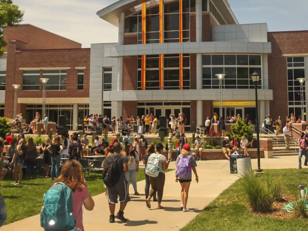 Students walking into a Wichita State University Campus building.