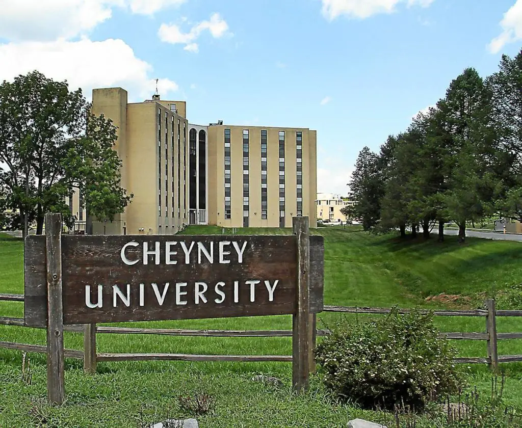 A sign reading "Cheyney University" on the school's campus.