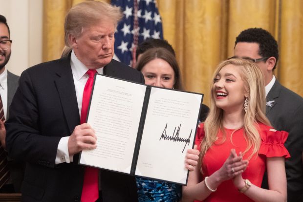 President Trump signing the executive order on campus free speech.