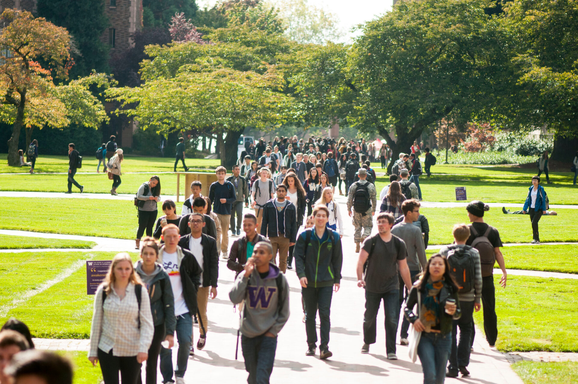 Students walking across the University of Washington campus.
