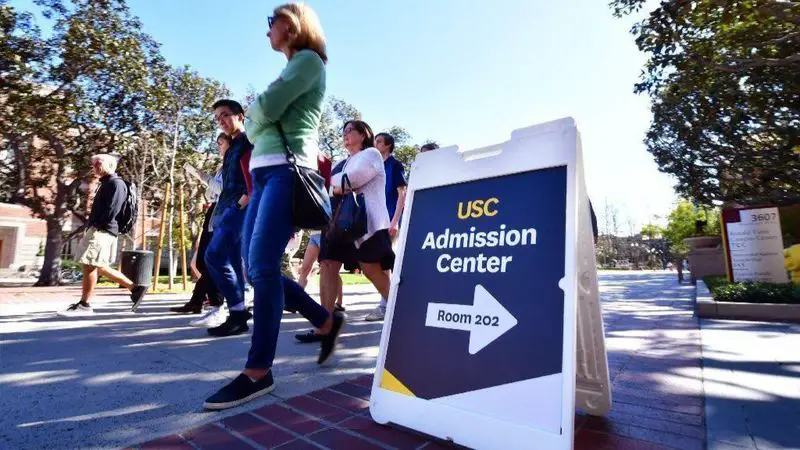 Adults and prospective students tour the University of South California in Los Angeles.