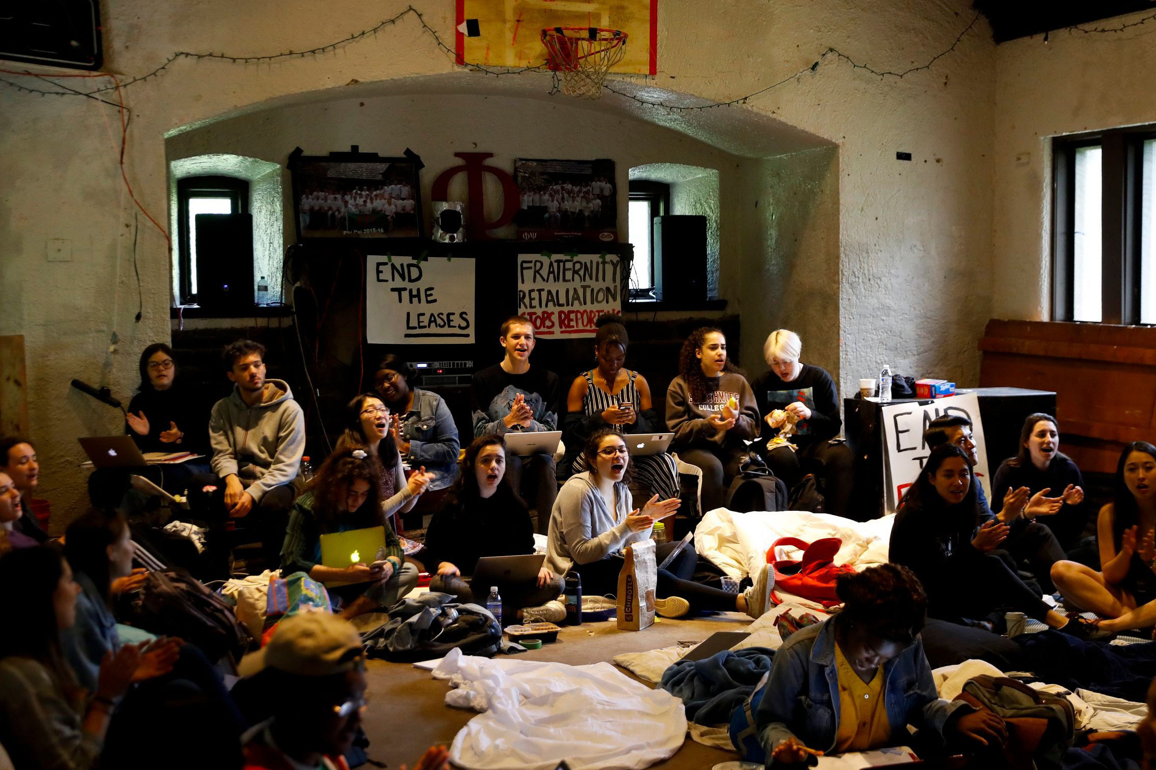 Swarthmore College students sing during a sit-in at the Phi Psi fraternity house, in Swarthmore, Pennsylvania.