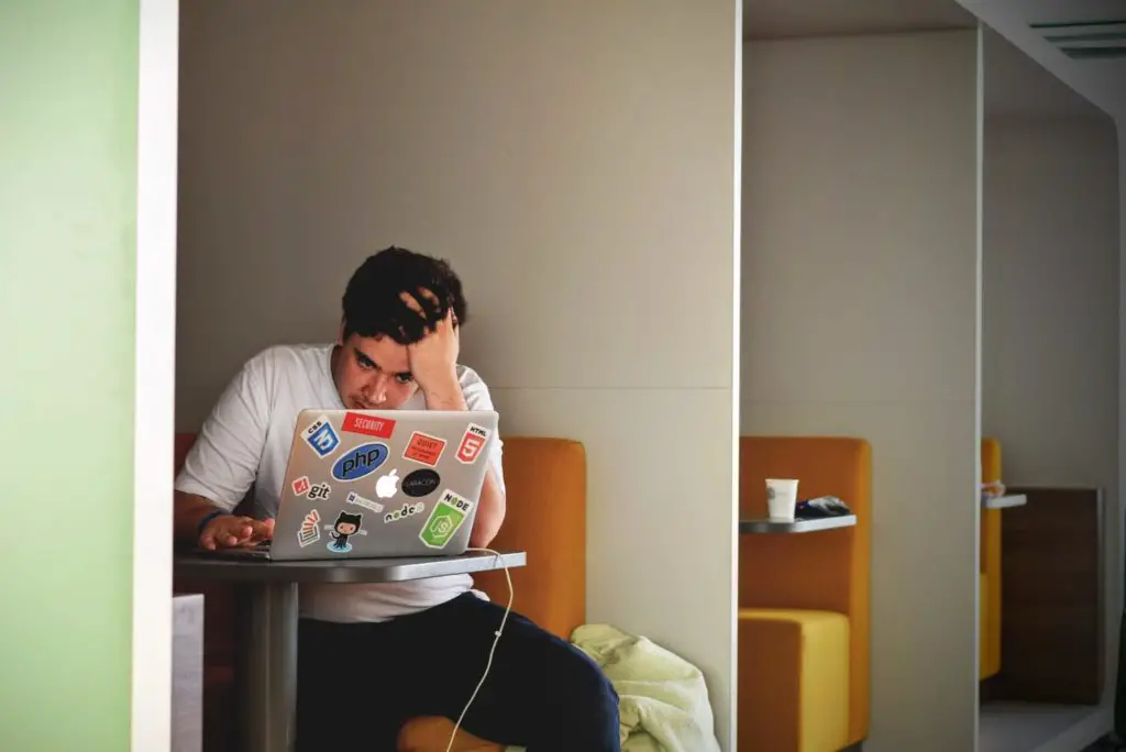 Student sitting behind his laptop