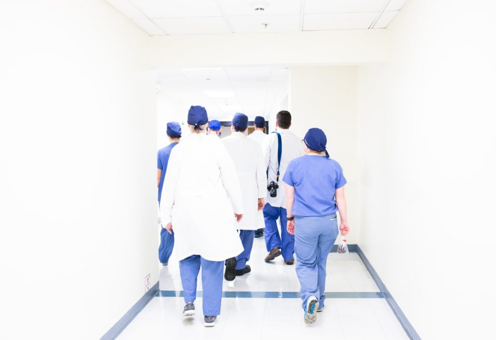 mature-age-doctors-walking-down-hallways