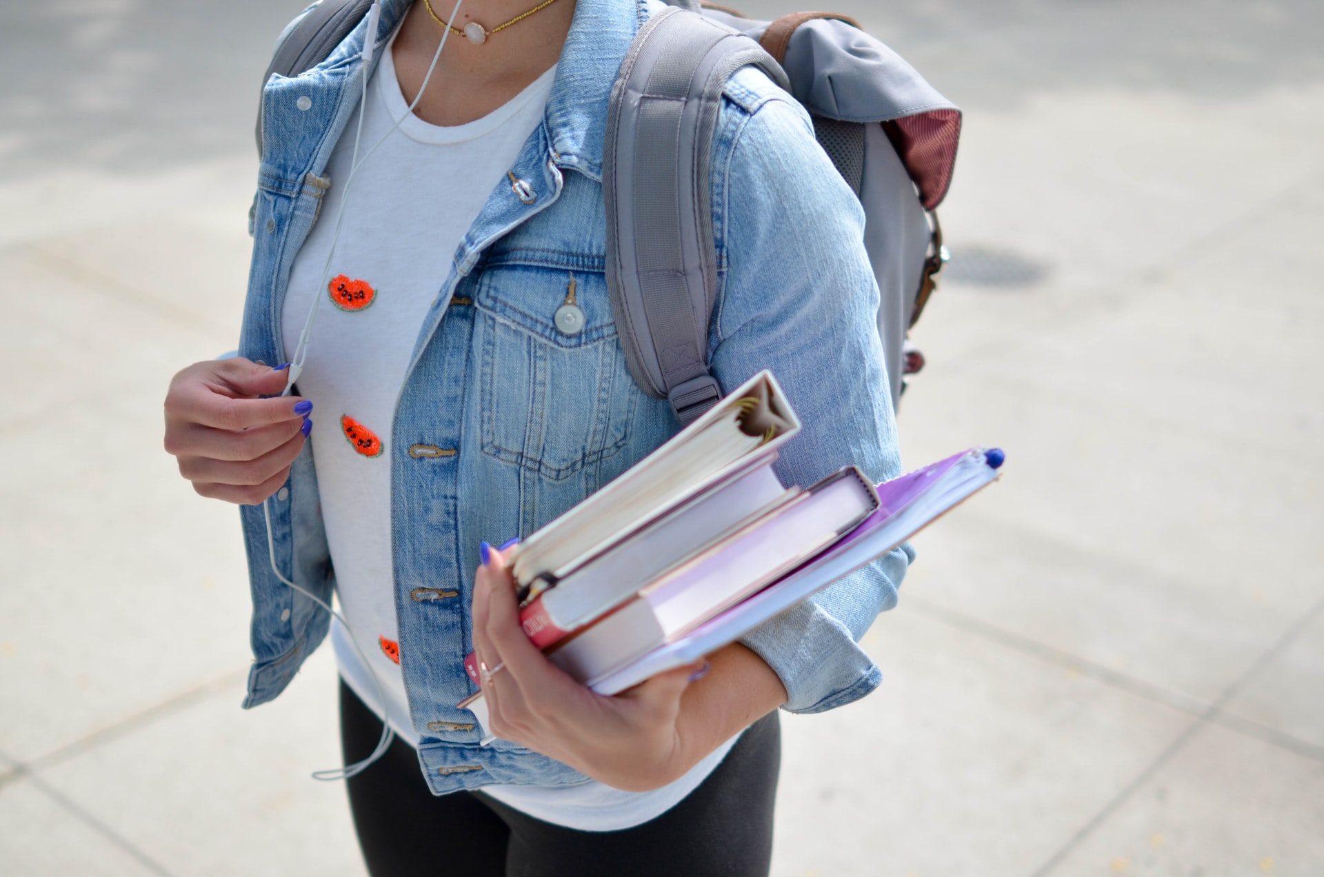 Photo of a student carrying books