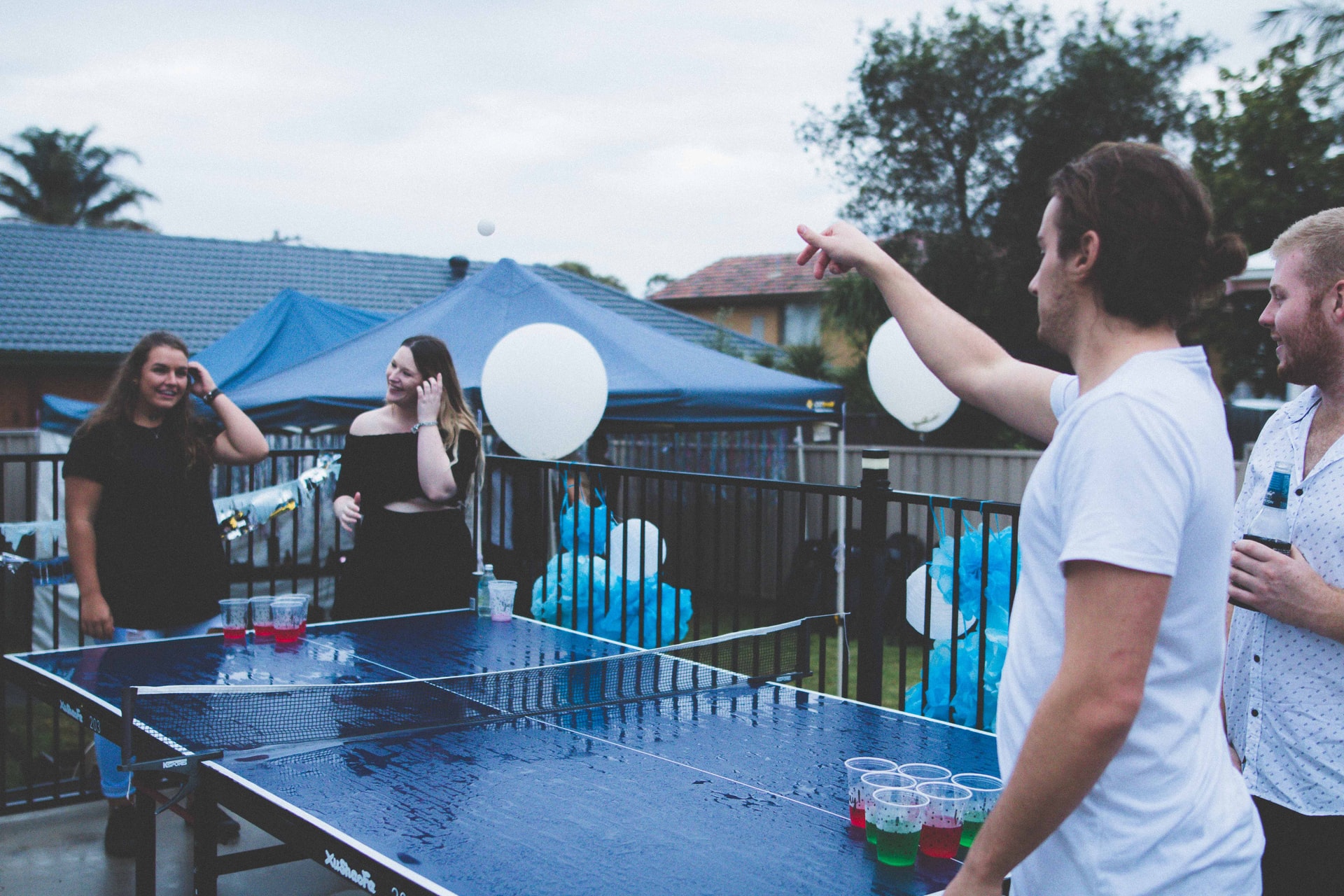 Photo of students playing beer pong