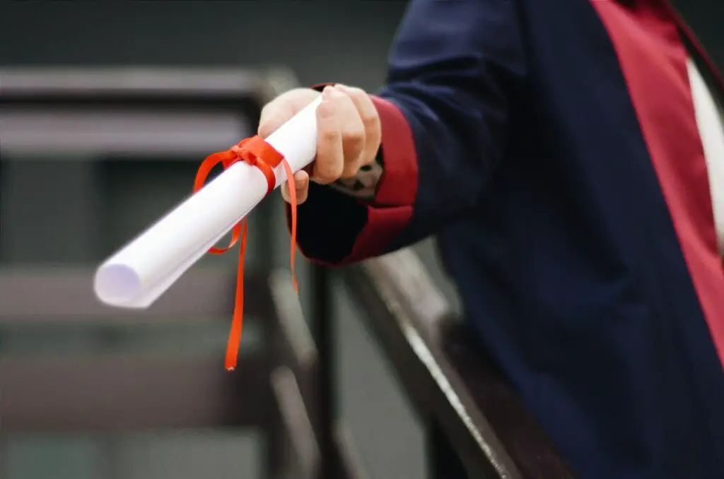 Photo of someone holding a diploma