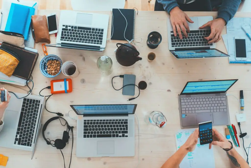 Workspace table with laptops and other gadgets