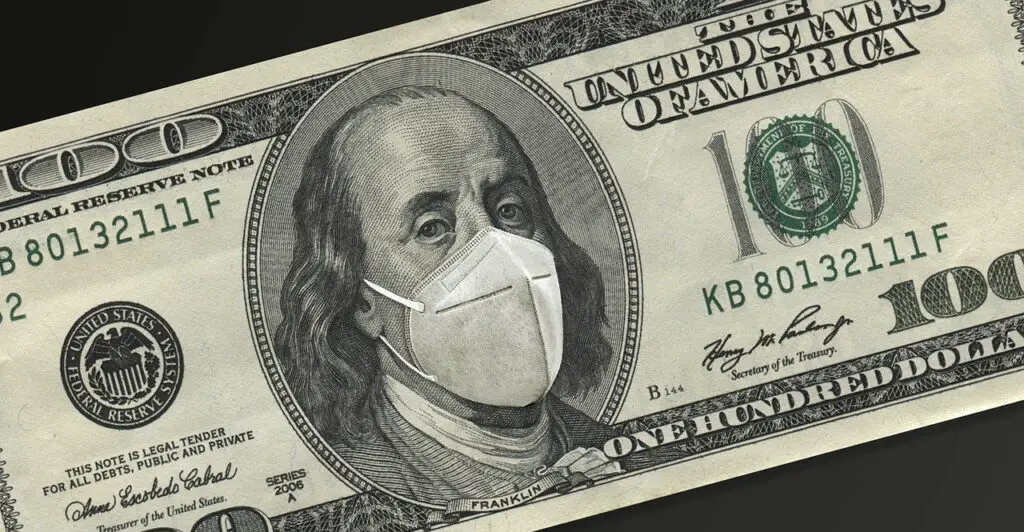 Photo of a dollar bill with a mask for COVID, relief package, stimulus benefits for college students