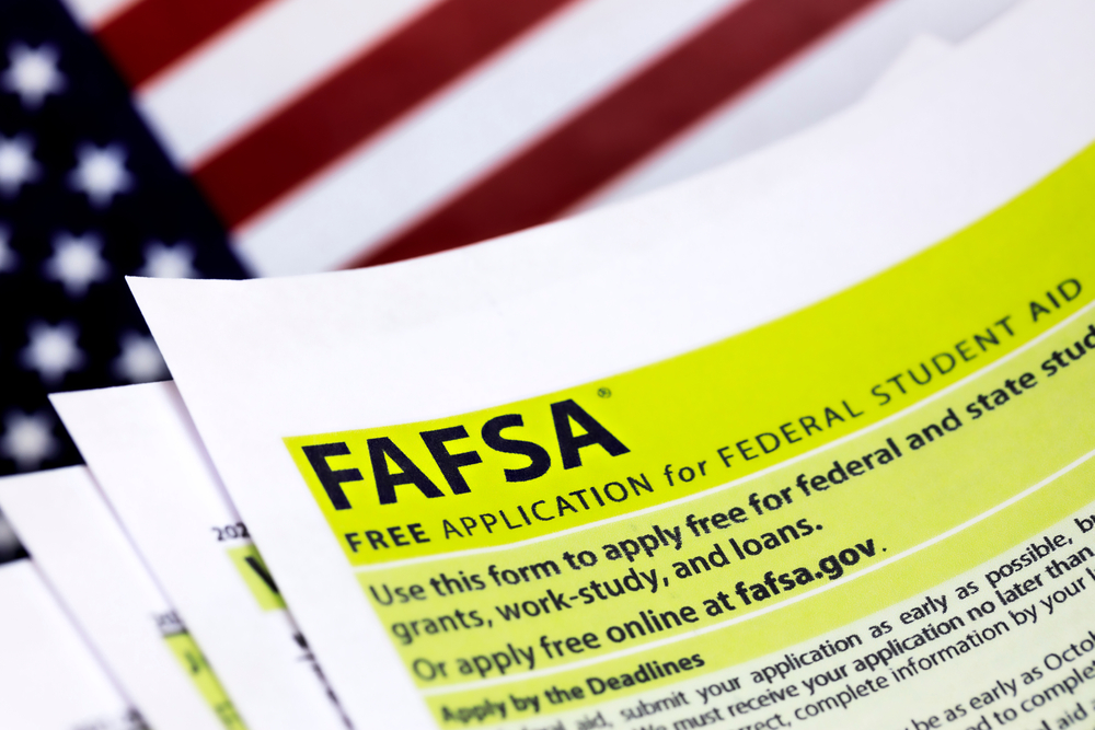 FAFSA federal student aid form on top of US flag