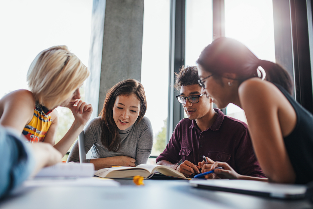 group-of-students-around-table-studying