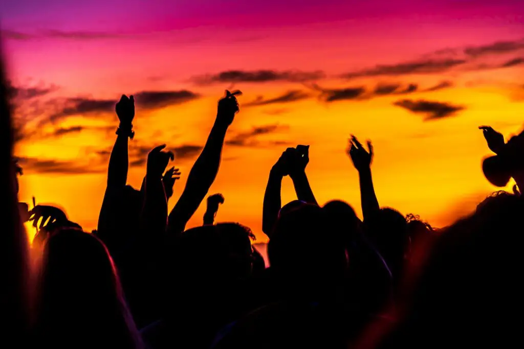 Photo of students partying at a party on the beach