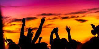 Photo of students partying at a party on the beach