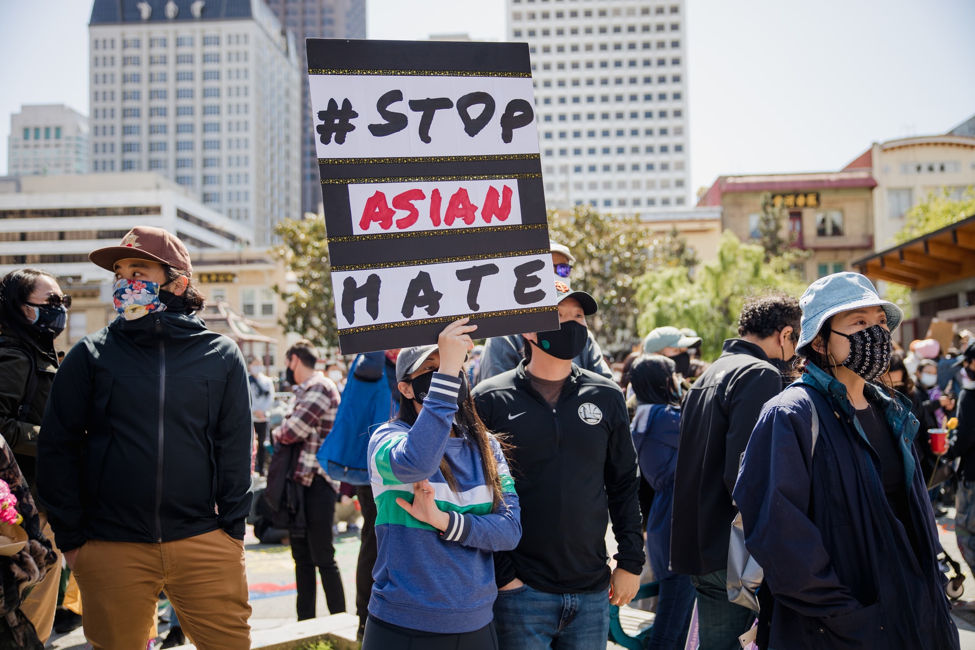 Protester holding up sign saying 'Stop Asian Hate'