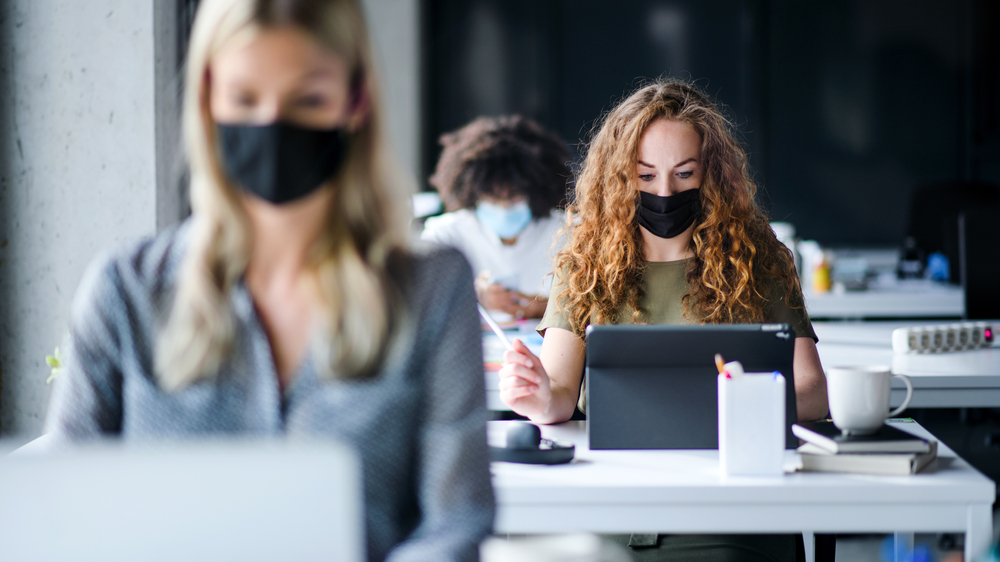 Students with face masks back at school in after COVID-19 lockdown.