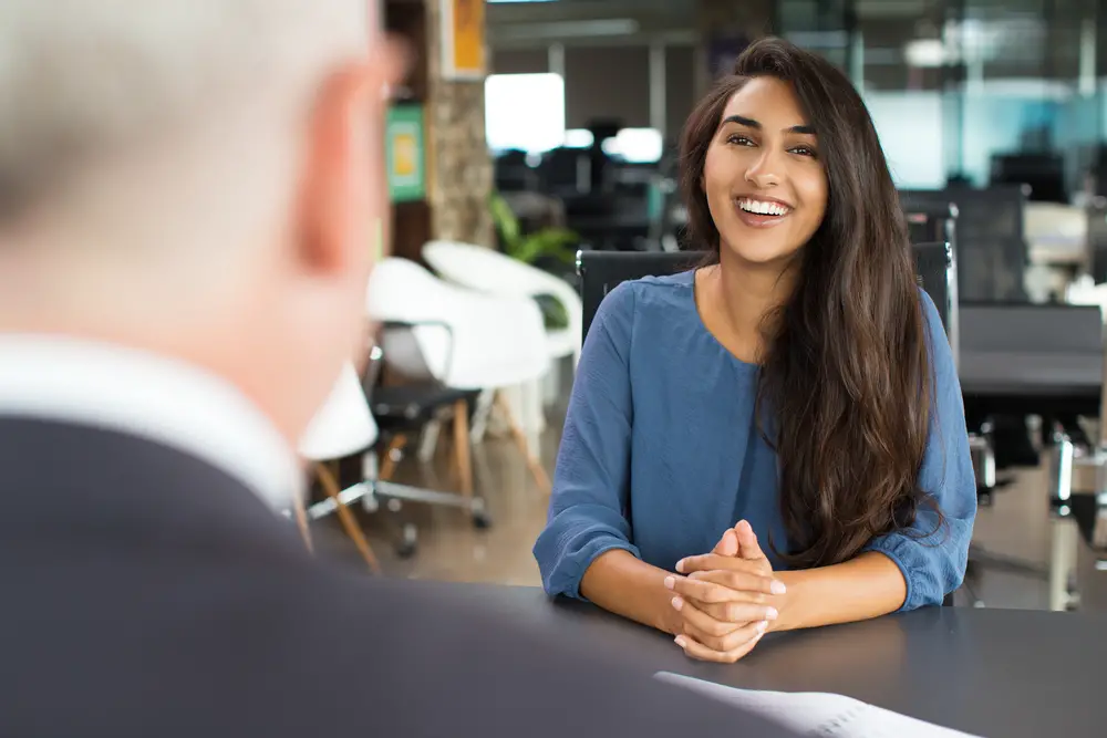 Female candidate smiling during a job interview