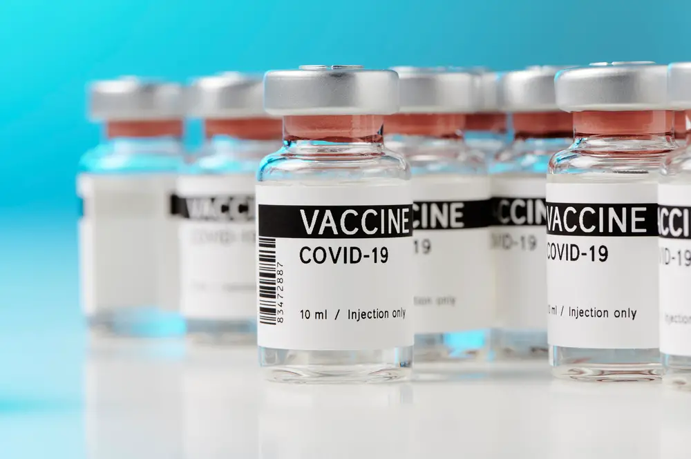 Ampoules with COVID-19 vaccine on a laboratory bench