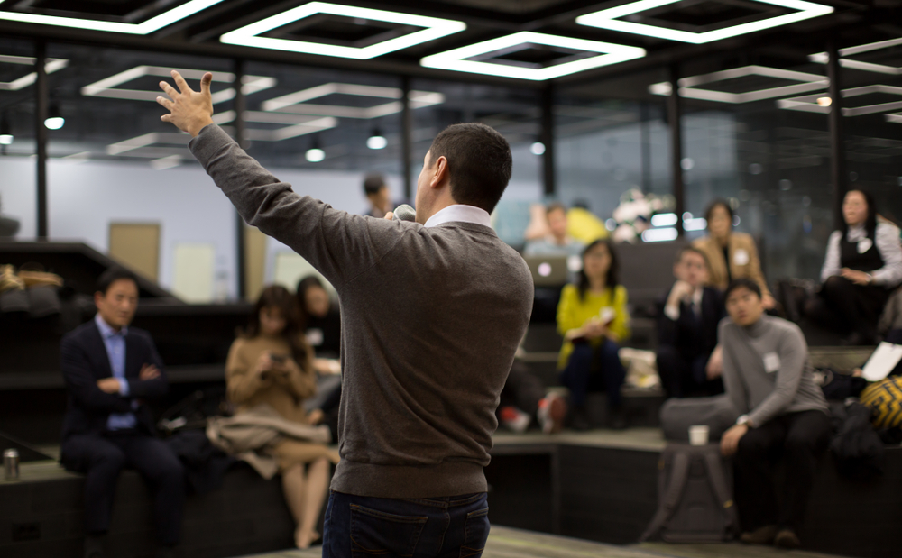 A presenter talking to the audience