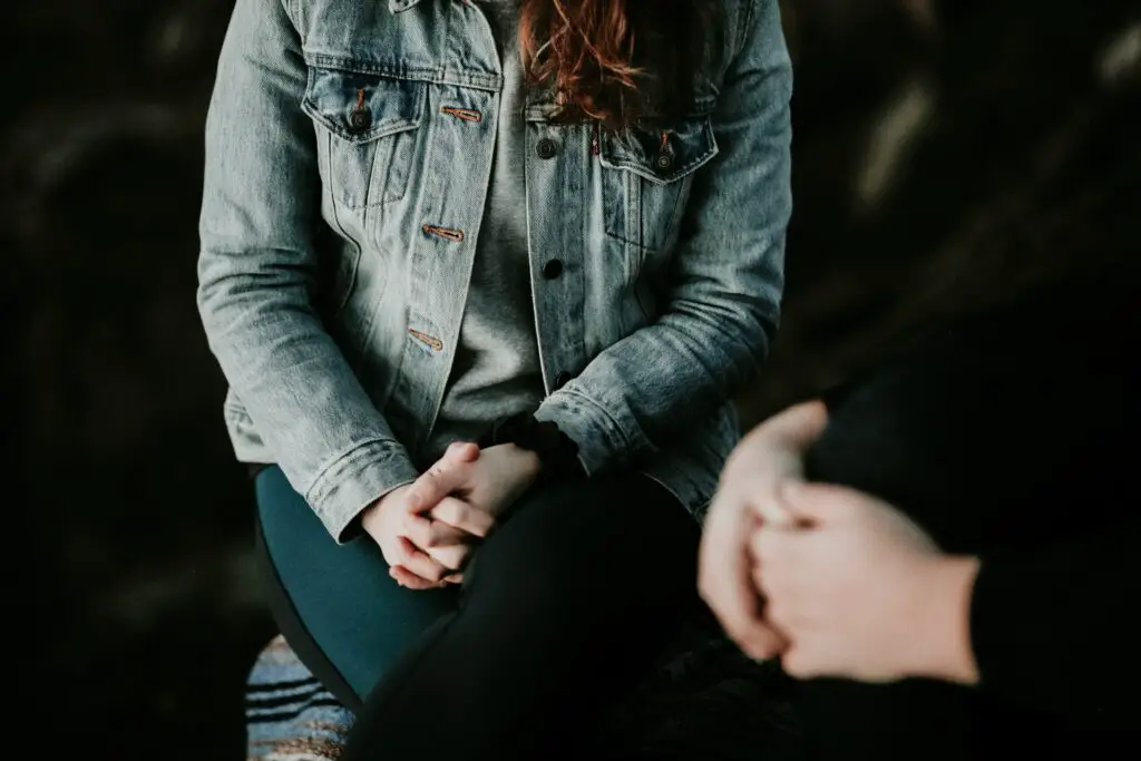 Picture of a person with long hair with someone.