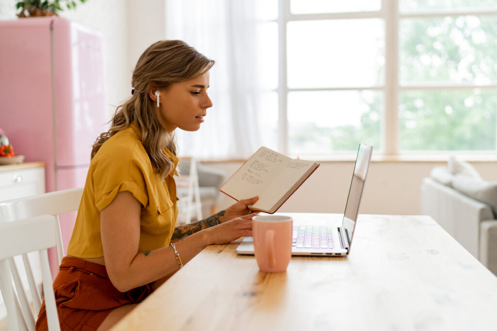 A pretty college student sitting in her dorm creating a FSA ID to fill out the FAFSA