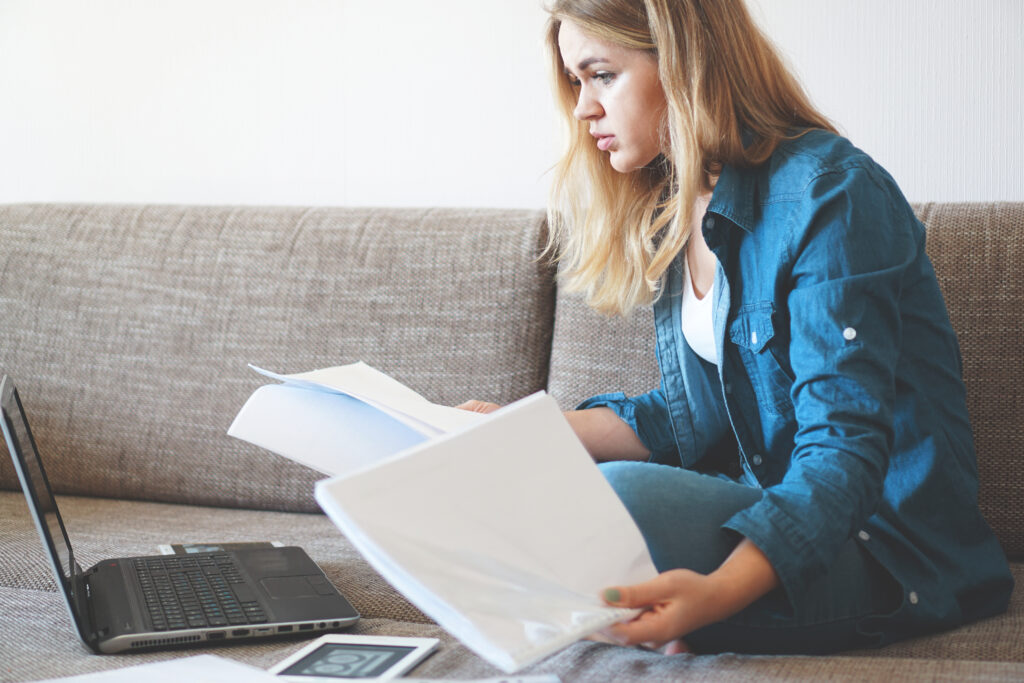 serious college student figuring out where, when, and how to submit her accomplished FAFSA