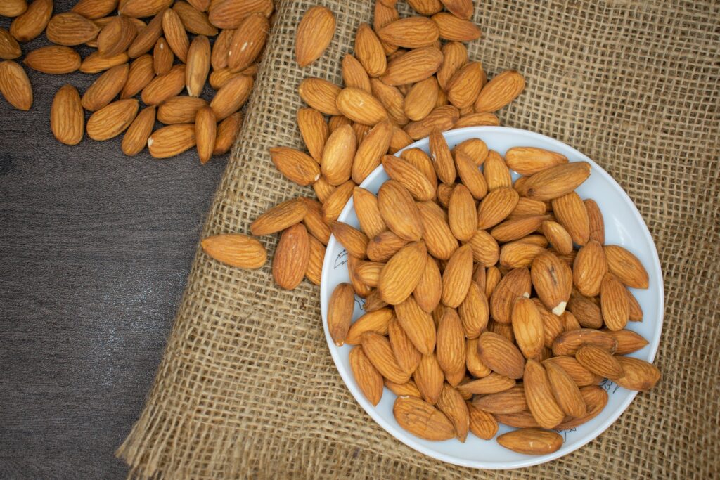 top-view-of-bowl-of-almonds-on-burlap