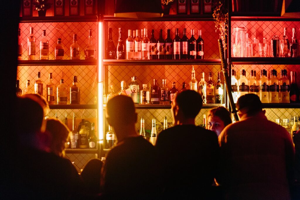 people waiting for a drink at a local bar