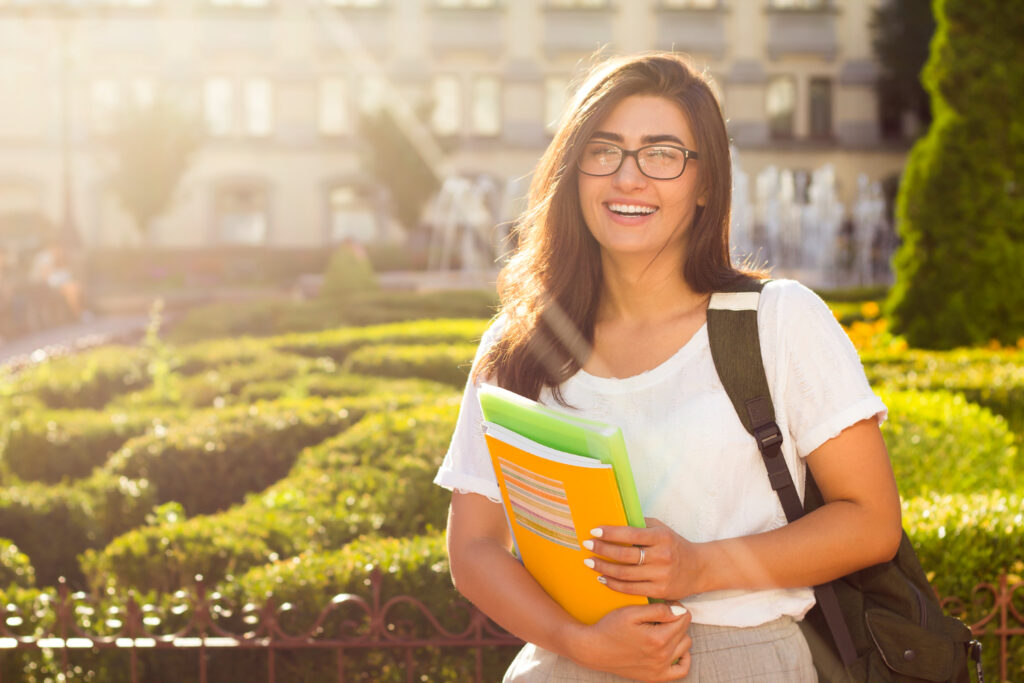 photo-of-happy-college-girl-outside-with-sun