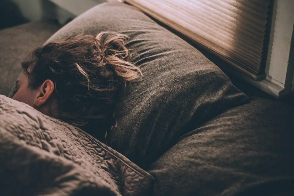 woman sleeping to get some rest and alleviate stress