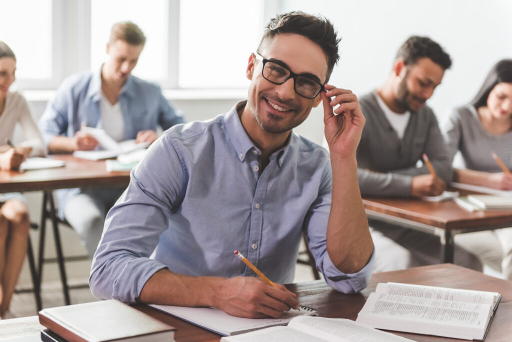 photo-of-middle-aged-man-smiling-in-college-class