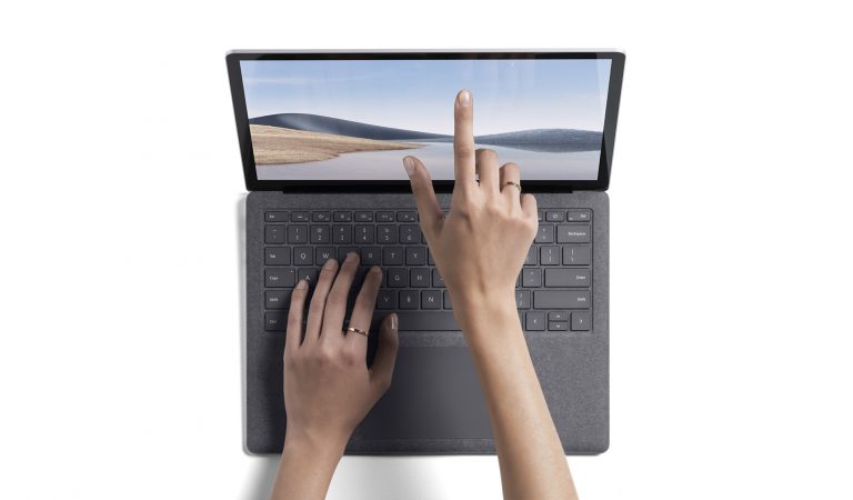 photo-of-student-hand-touching-surface-laptop-4