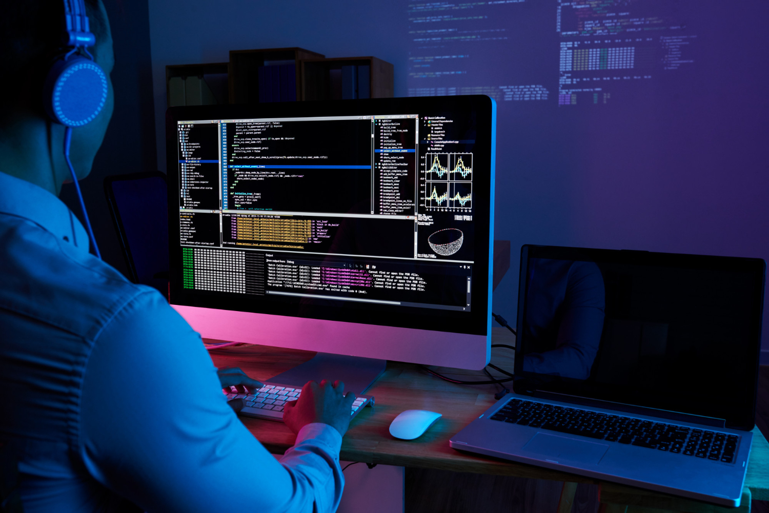 photo-of-programmer-working-on-computer-at-night