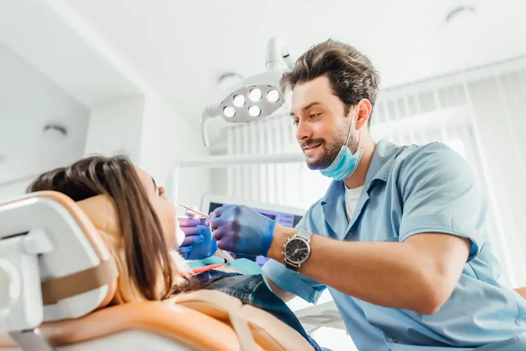 photo-of-dental-technician-treating-patient