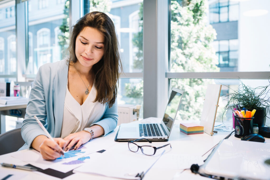 photo-of-female-economist-working-at-desk