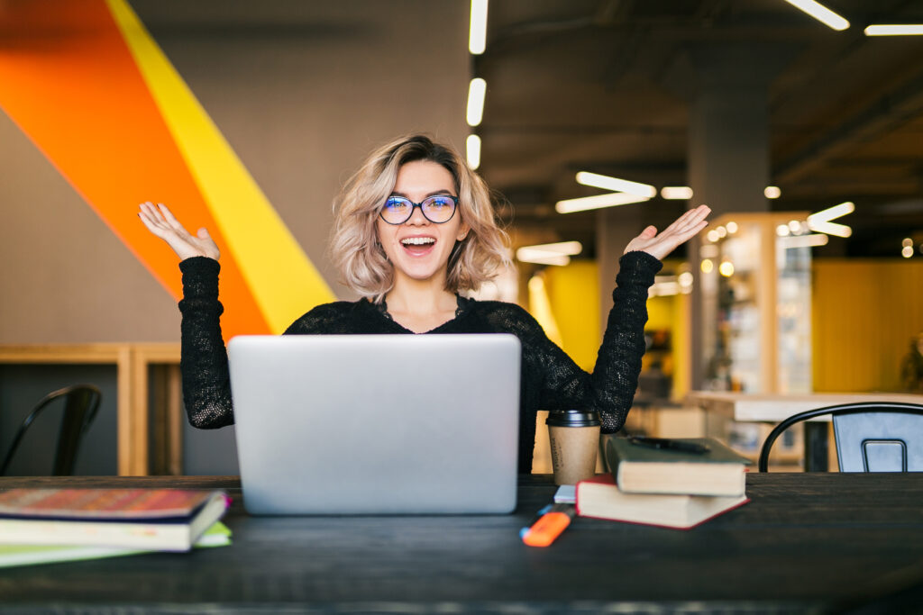 A happy woman with her laptop