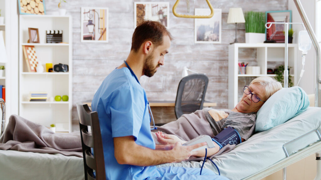 photo-of-male-nurse-helping-elderly-patient