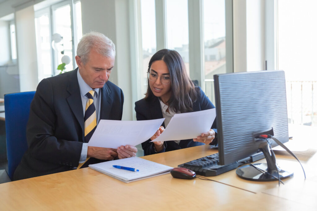 photo-of-paralegal-talking-with-lawyer