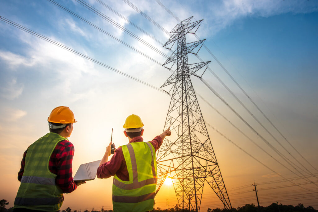 photo-of-two-electrical-engineers-pointing-at-communications-tower