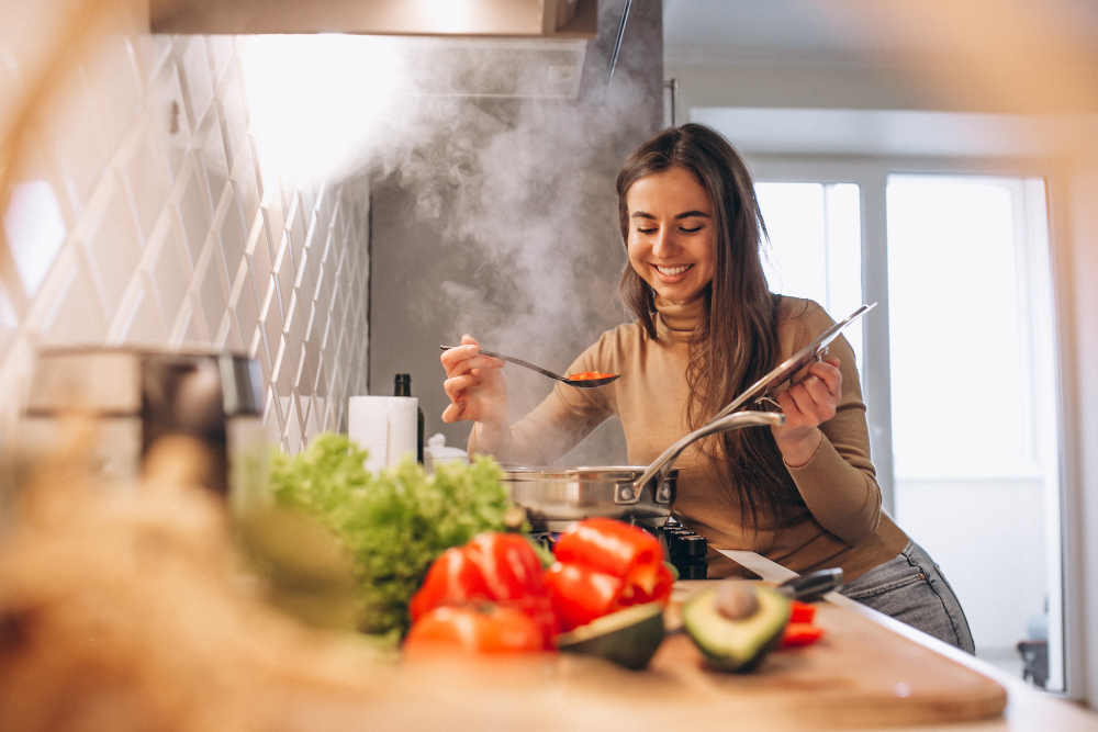 photo-of-student-cooking-in-dorm-kitchen-using-recipe-website