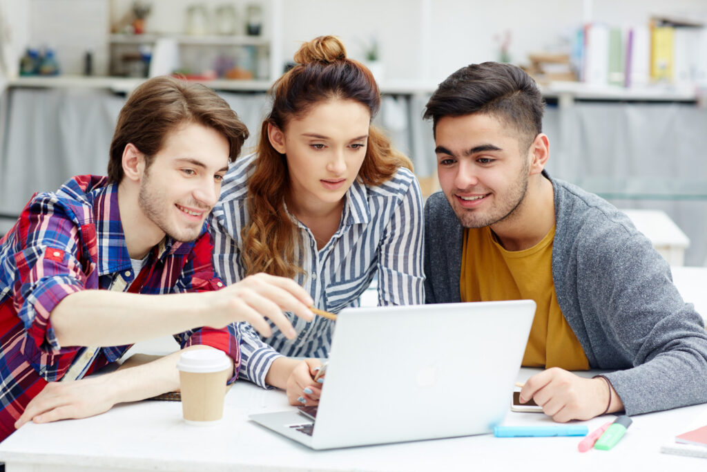 photo-of-three-college-writing students-in-discussion