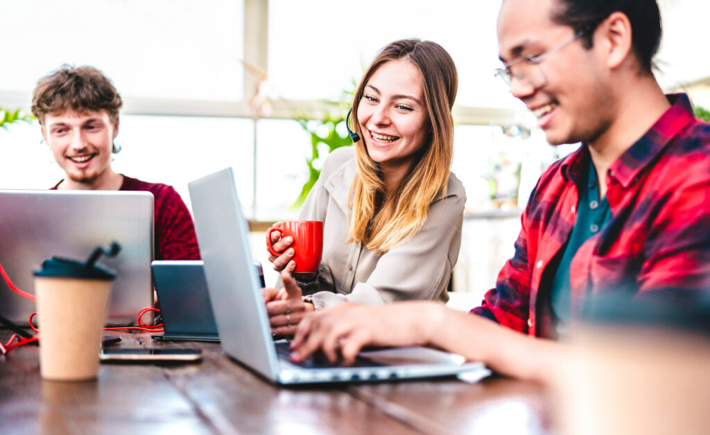 young-interns-laughing-at-desk