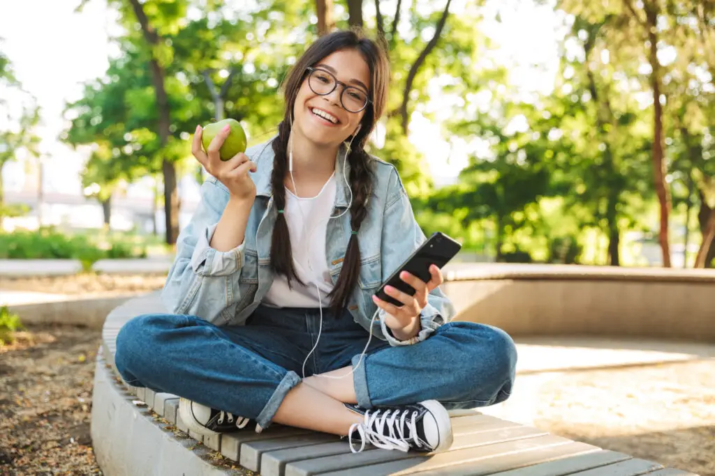 fit-and-healthy-female-student-holding-apple