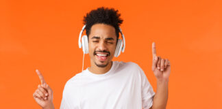 happy student listening to a good study playlist