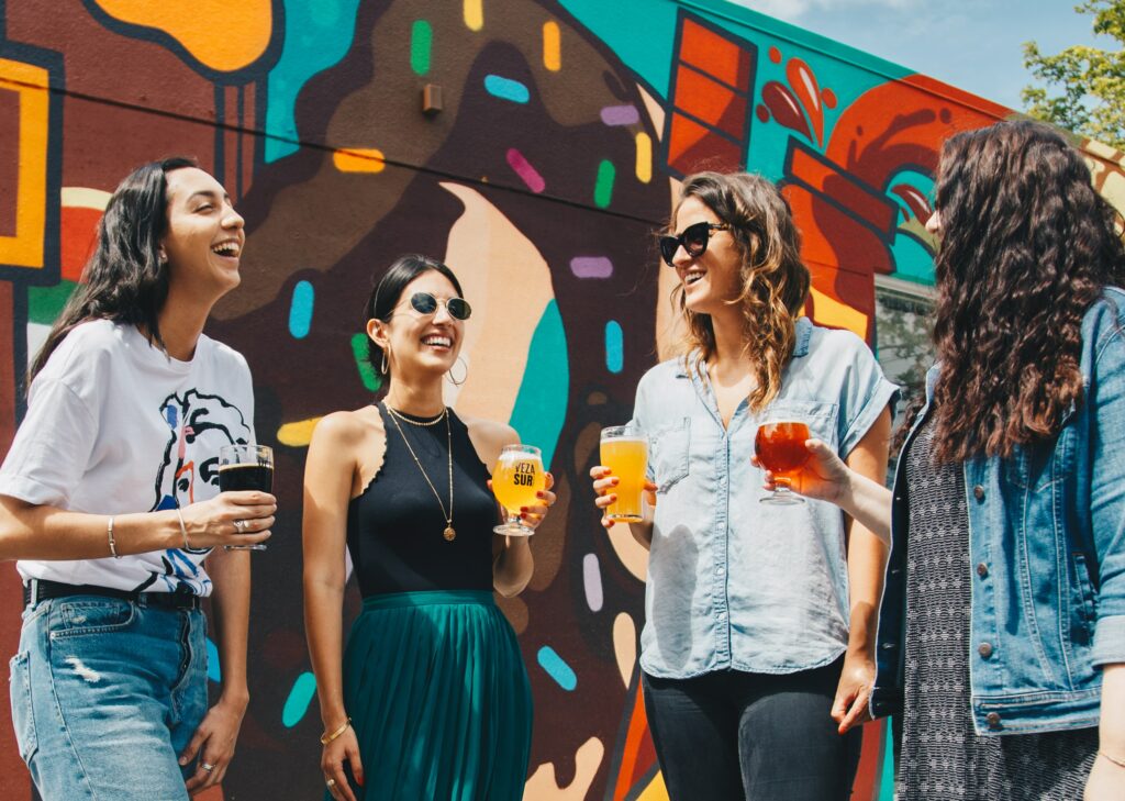 Women holding beers 