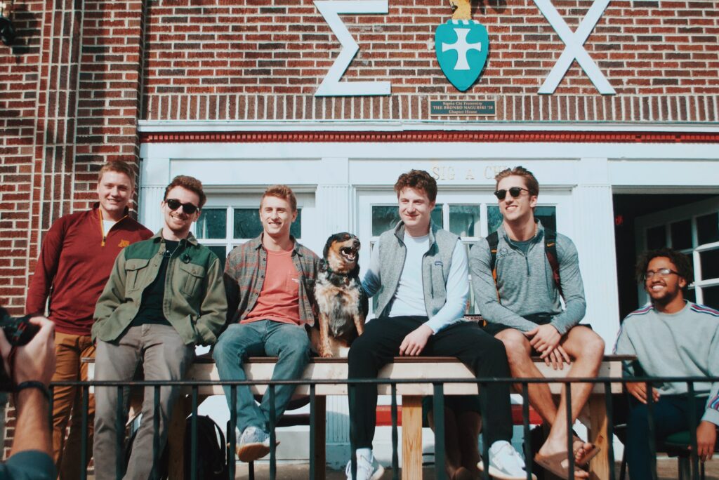 Group sitting in front of a building