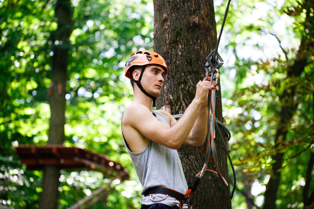 Man prepares to climb on the ropes in the park